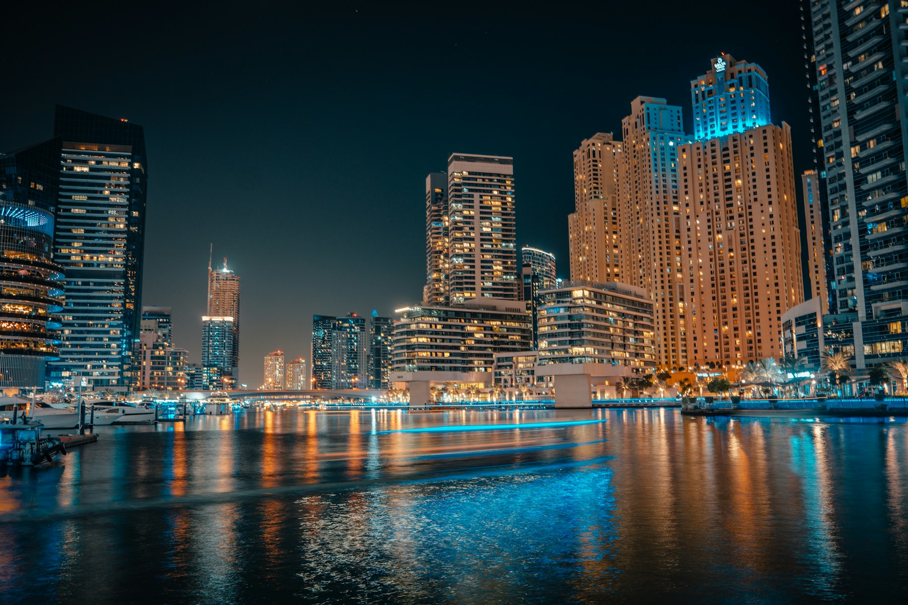 Dubai Marina’s architecture and waterfront at night